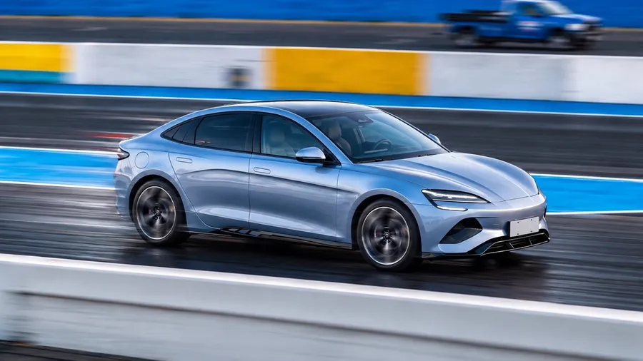 An electric saloon at full acceleration down the instrumented drag strip.